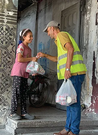 The first phase of distributing canned meat to families in northern Gaza