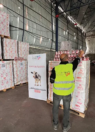 Assembling canned meat parcels for distribution in northern Gaza